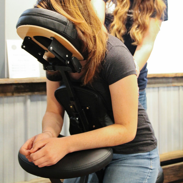 woman receiving a chair massage